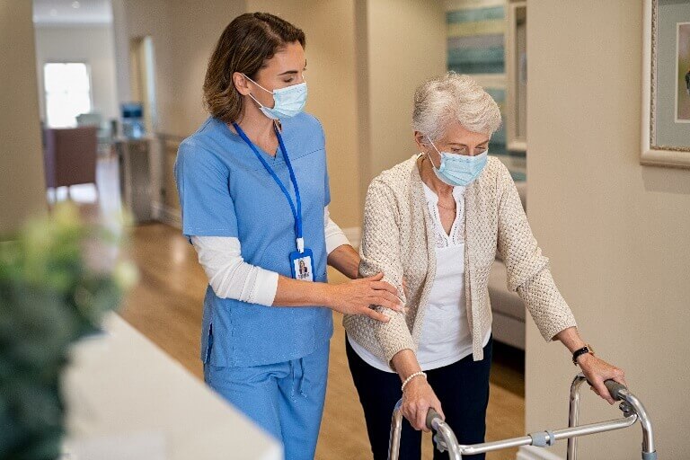 A Nurse Assisting Elderly in Aged Care Facility